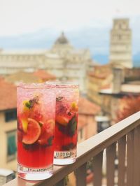 Close-up of drink served on table against sea