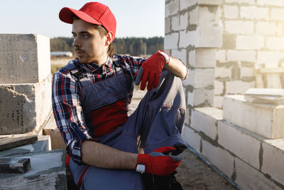 Side view of man using mobile phone