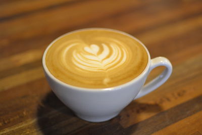 Close-up of cappuccino on table