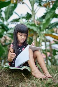 Girl sitting on mobile phone