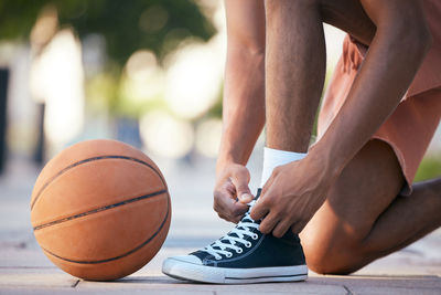 Low section of man playing basketball