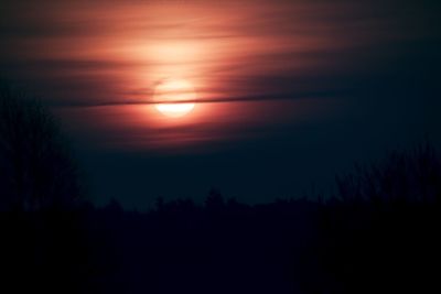 Scenic view of silhouette landscape against sky at sunset