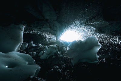 Close-up of snow on rock in cave