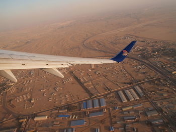 Aerial view of airplane flying over landscape
