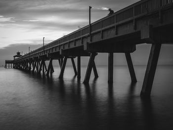 Pier over sea against sky