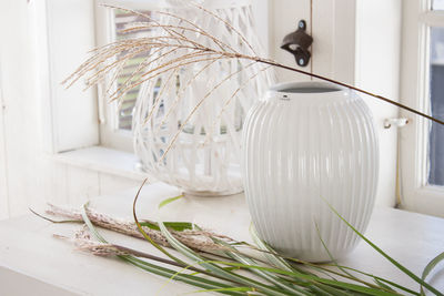 Close-up of white vase on table at home