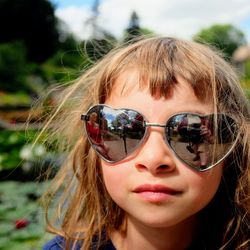 Close-up portrait of woman with sunglasses