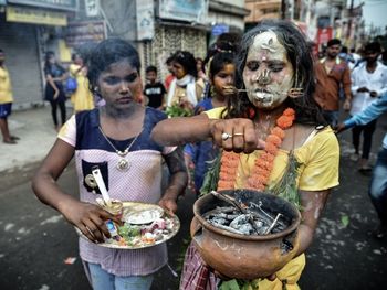 Group of people at market stall in city