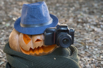 Close-up of camera wearing hat