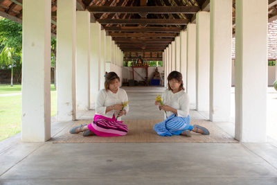 Women sitting in corridor