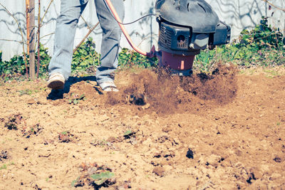 Rear view of man working at construction site