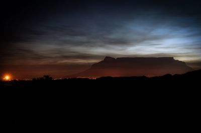 Silhouette mountains against sky during sunset