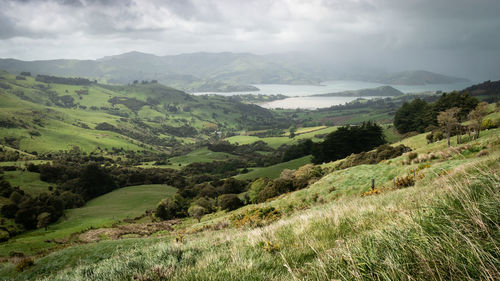 Storm approaching a valley with green rolling hills, new zealand