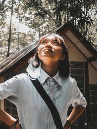 Portrait of a young woman looking away