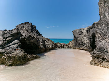 Scenic view of sea against clear blue sky