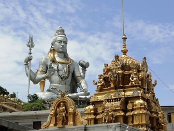 Low angle view of sculptures and carvings at temple