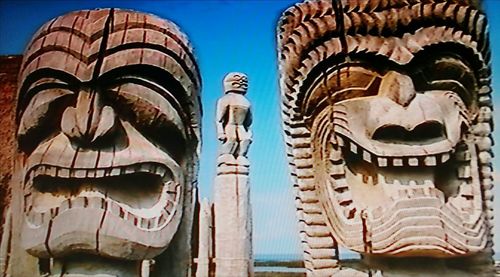 Low angle view of statue against temple building