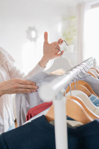 Midsection of man holding woman at home