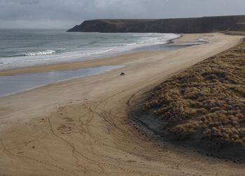 Scenic view of beach against sky