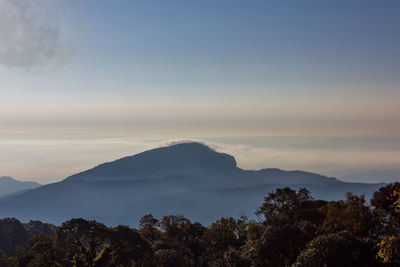 Scenic view of mountains against sky at sunset