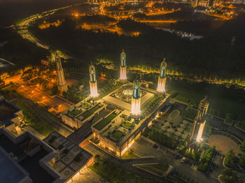 High angle view of illuminated buildings in city at night