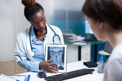 Doctor examining patient at clinic