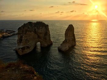 Scenic view of sea against sky during sunset