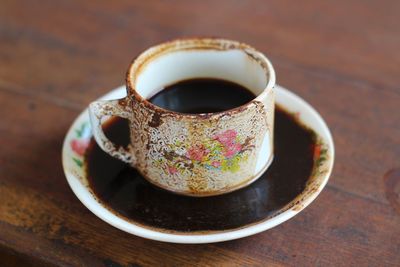 High angle view of coffee cup on table