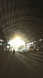 People walking on railroad station platform