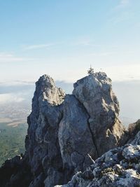 Rock formations on mountain against sky