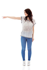 Full length of woman standing against white background