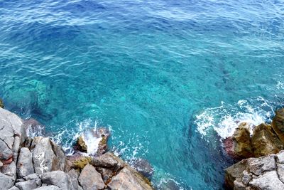 High angle view of rocks in sea