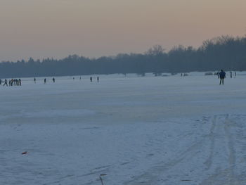 Scenic view of snow covered landscape against sky