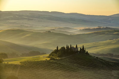 Scenic view of landscape against sky during sunset