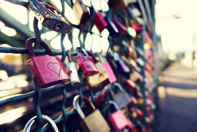 Close-up of padlocks on railing