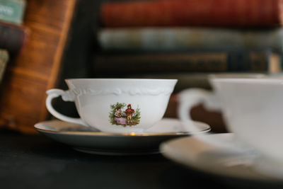 Close-up of coffee cup on table