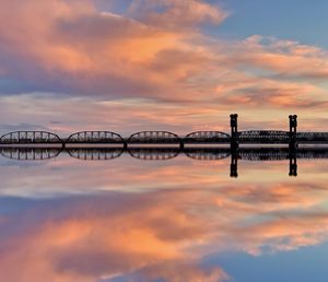 Beautiful sunset reflection in the columbia river, train tressel in the background