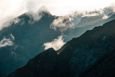 Scenic view of the dance of clouds around lofoten's mountains. ideal for nature projects.