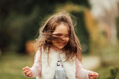 Portrait of cute girl wearing hat outdoors