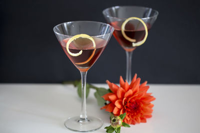 Close-up of wine in glass against black background