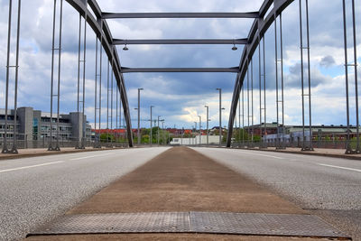 View of bridge against cloudy sky