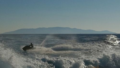 Scenic view of sea against blue sky