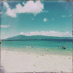 Scenic view of sea against cloudy sky