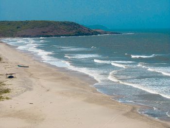 Scenic view of beach against clear sky