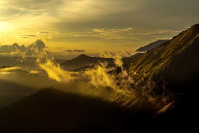 Panoramic view of silhouette mountains against sky during sunset