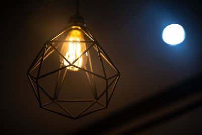 Low angle view of illuminated lamp