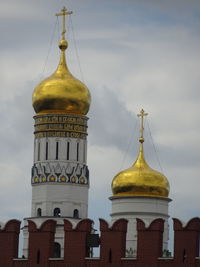 Clock tower amidst buildings against sky