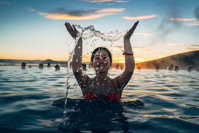 Portrait of woman at beach during sunset