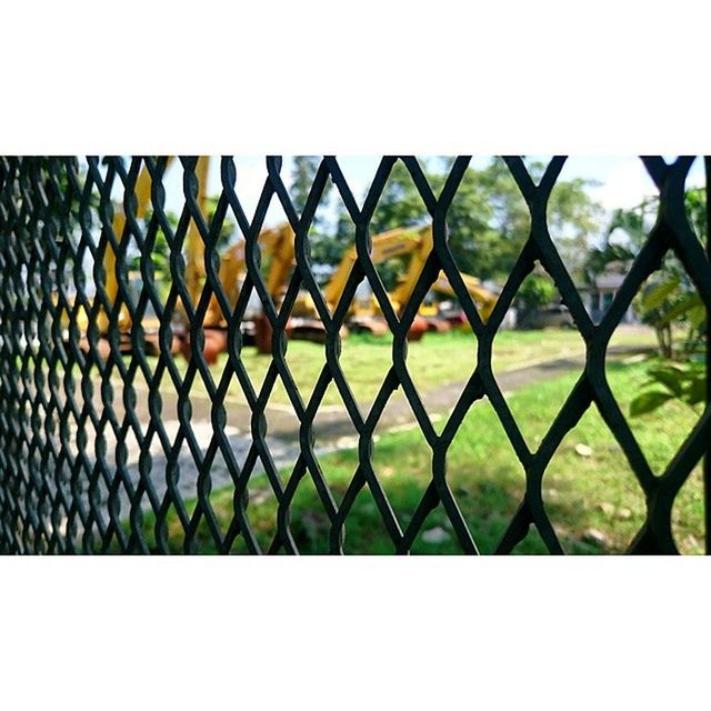 fence, protection, chainlink fence, safety, metal, transfer print, security, pattern, full frame, auto post production filter, focus on foreground, close-up, day, backgrounds, outdoors, no people, nature, metallic, sunlight, metal grate