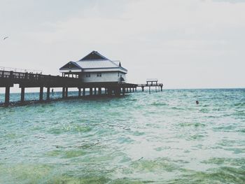 Pier on sea against sky